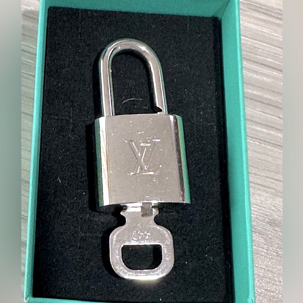 447 series Louis Vuitton silver lock and key